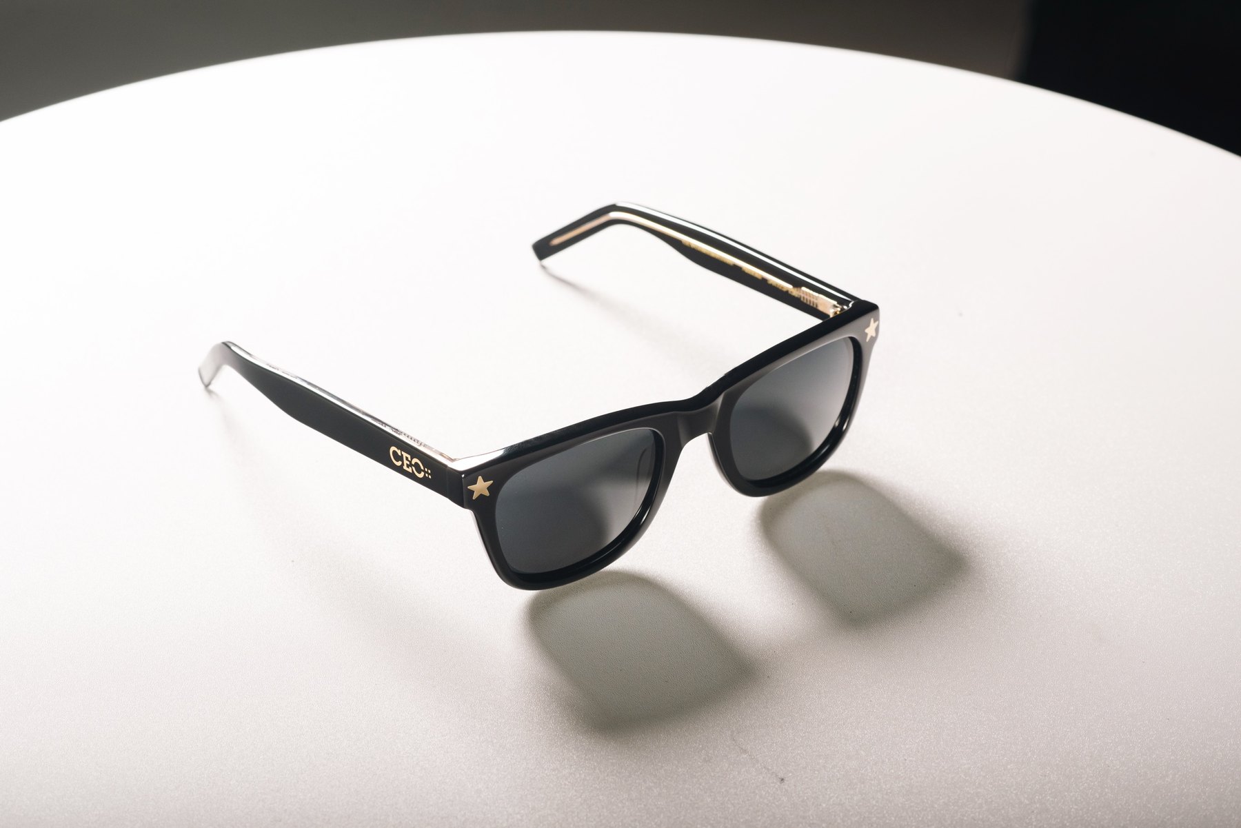 CEO Country Club black glasses on a white table