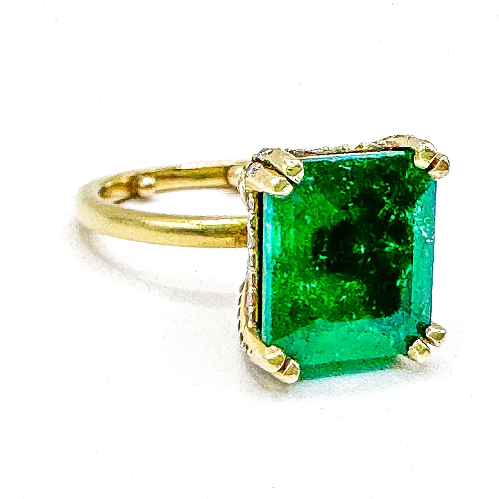 Emerald-cut emerald ring in yellow gold